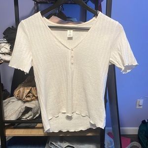 Selling a white button crop top from H&M